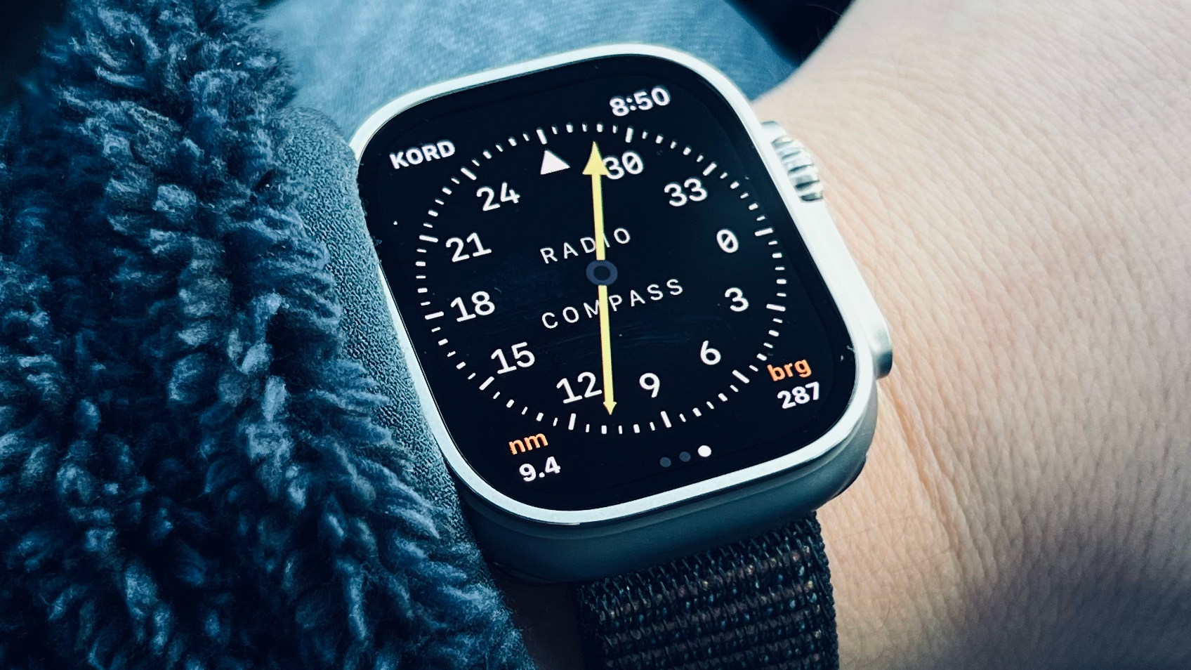 Fly Baby RMI (radio compass) instrument on a person's wrist
